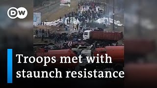 Footage shows how citizens try to stall Russian forces all over Ukraine  DW News [upl. by Allesig]